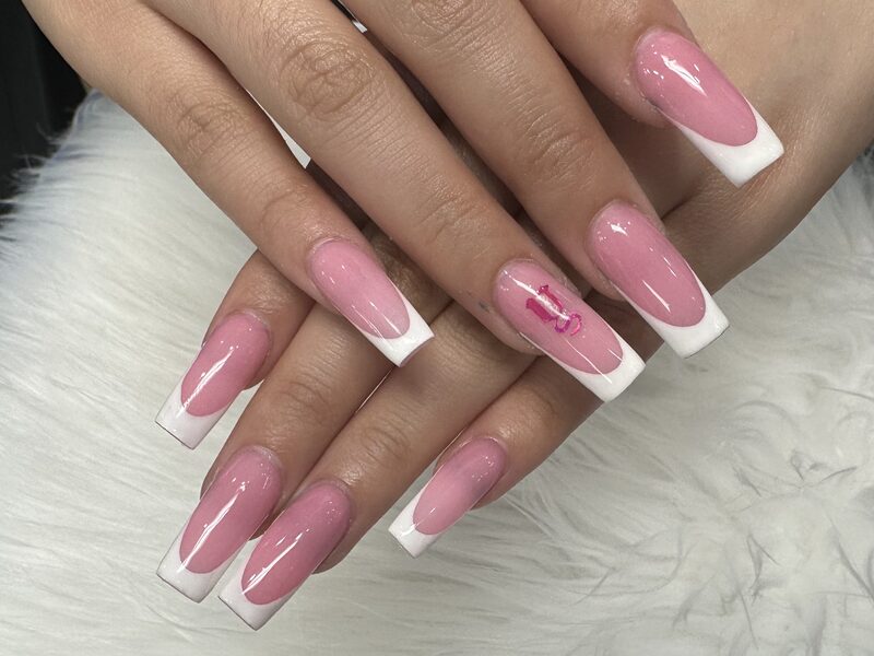 Long pink coffin nails with white french tips and ribbon accent