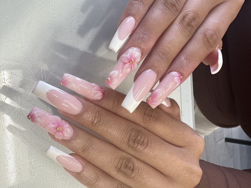 Long pink coffin nails with 3D cherry blossom and white french tips