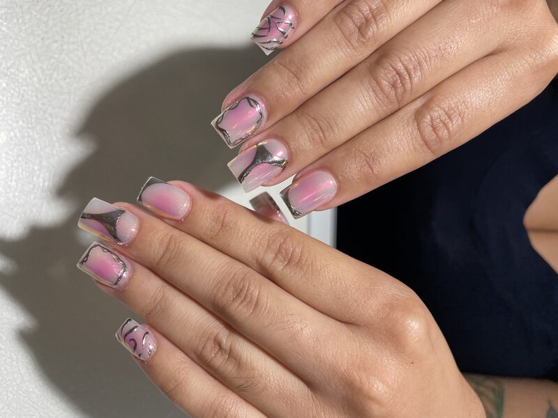 Nude coffin nails with multicolor marbled tip design