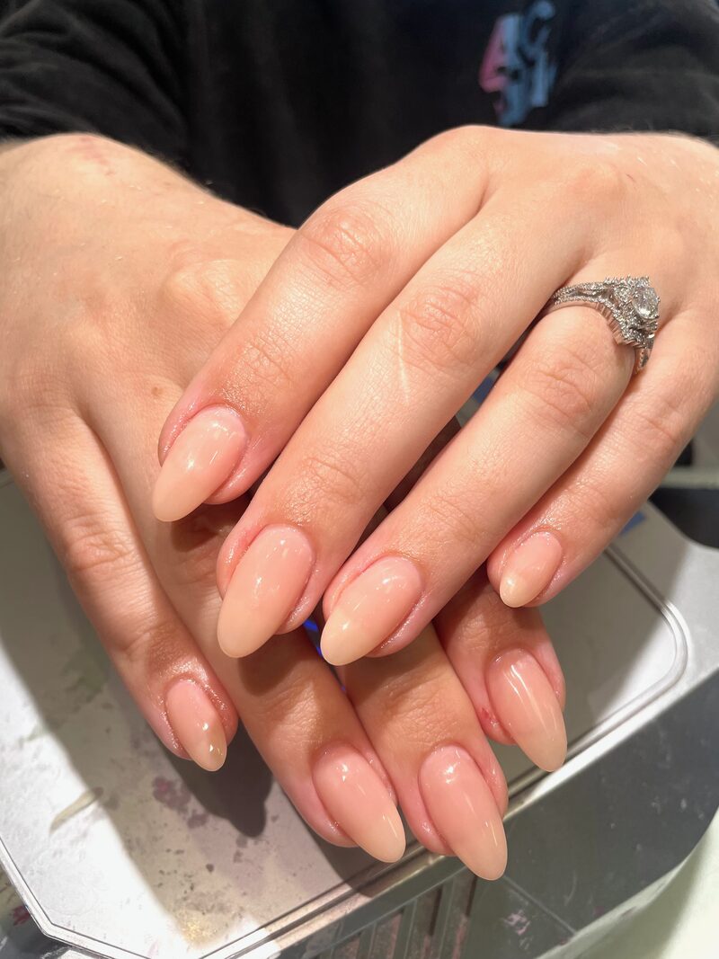 Natural nude almond-shaped nails with clean finish