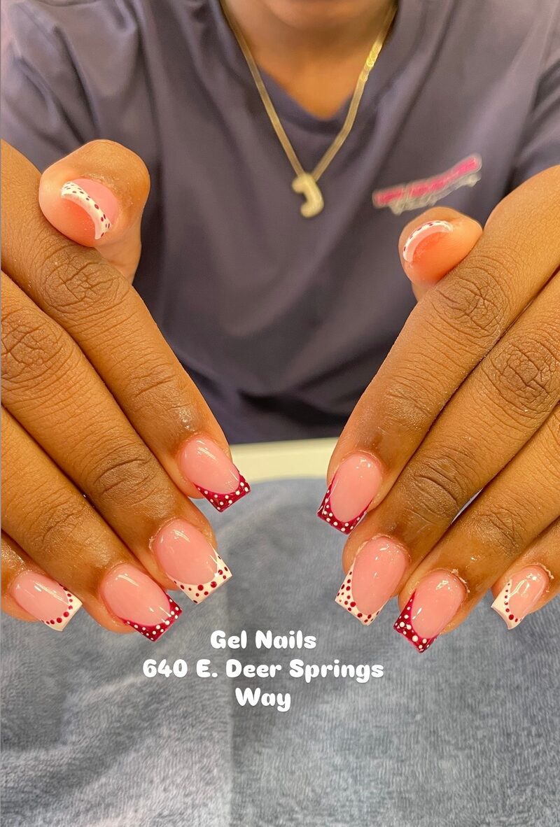 Red and white polka dot french tip nail art